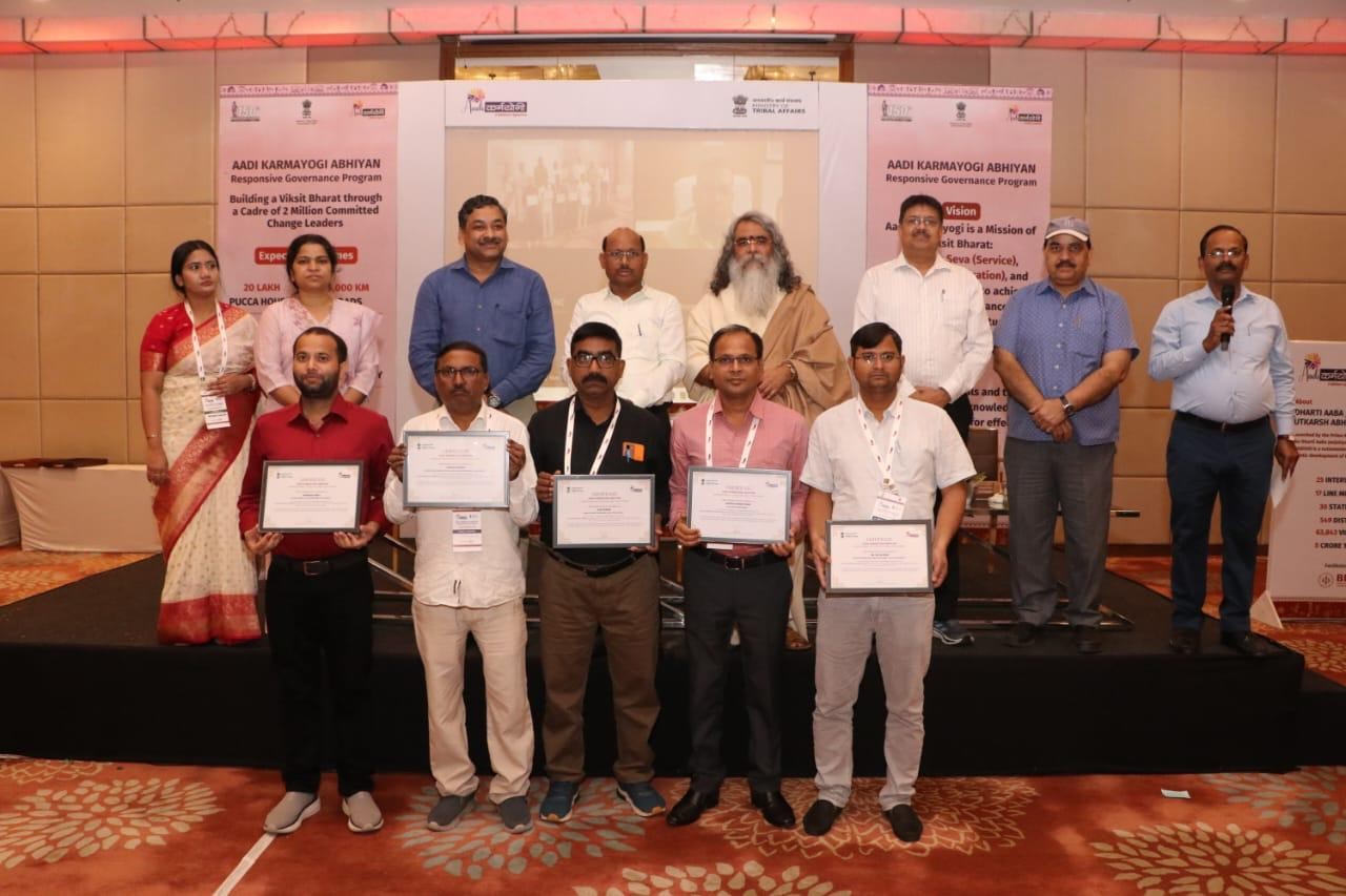 Certificates presented on stage at a campaign event