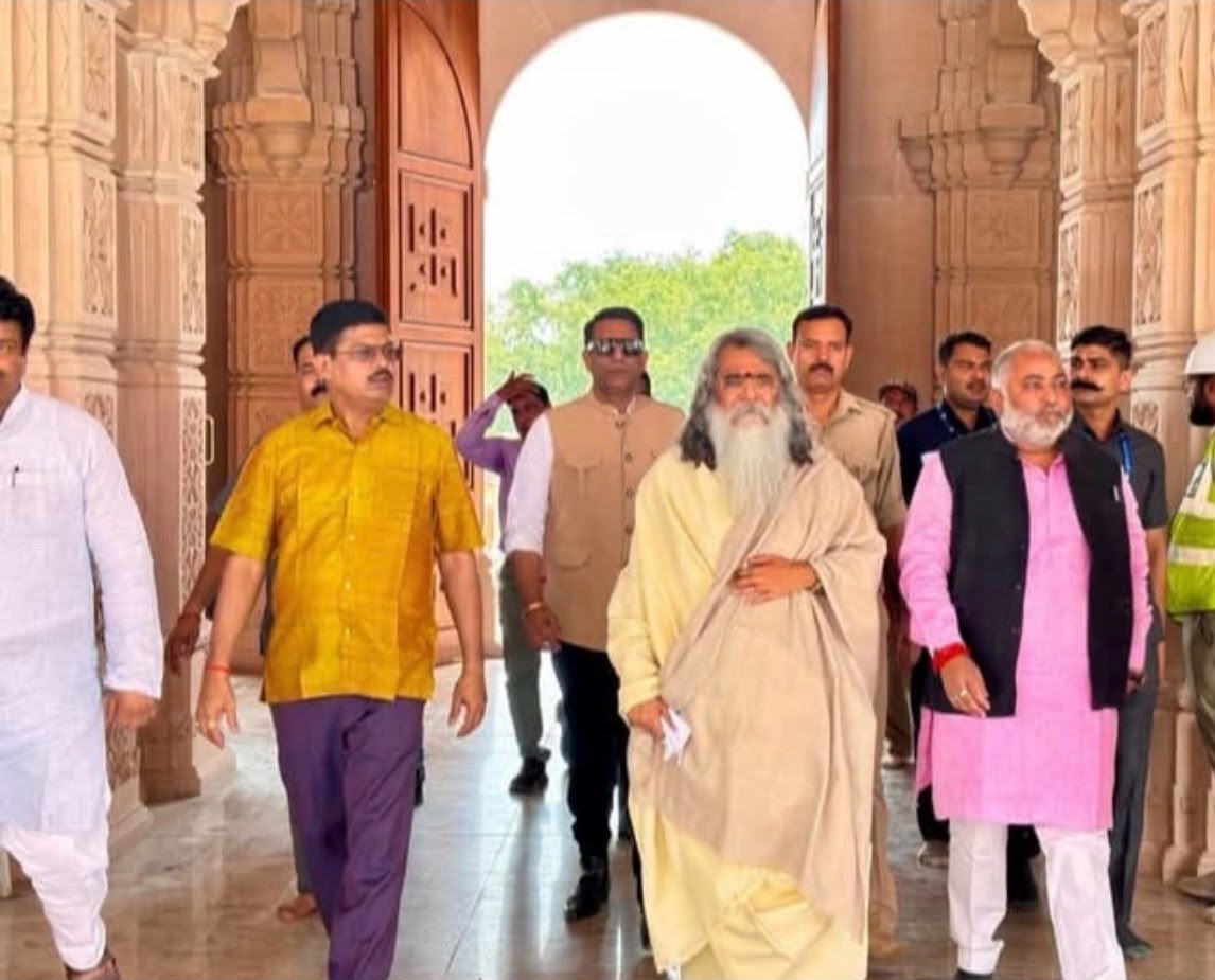 Devotees walking through the stone archway