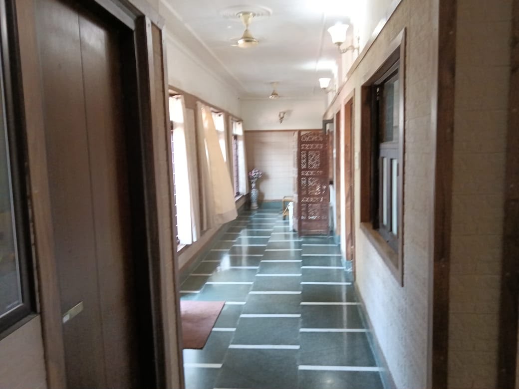 Quiet stone hallway leading to the rooms